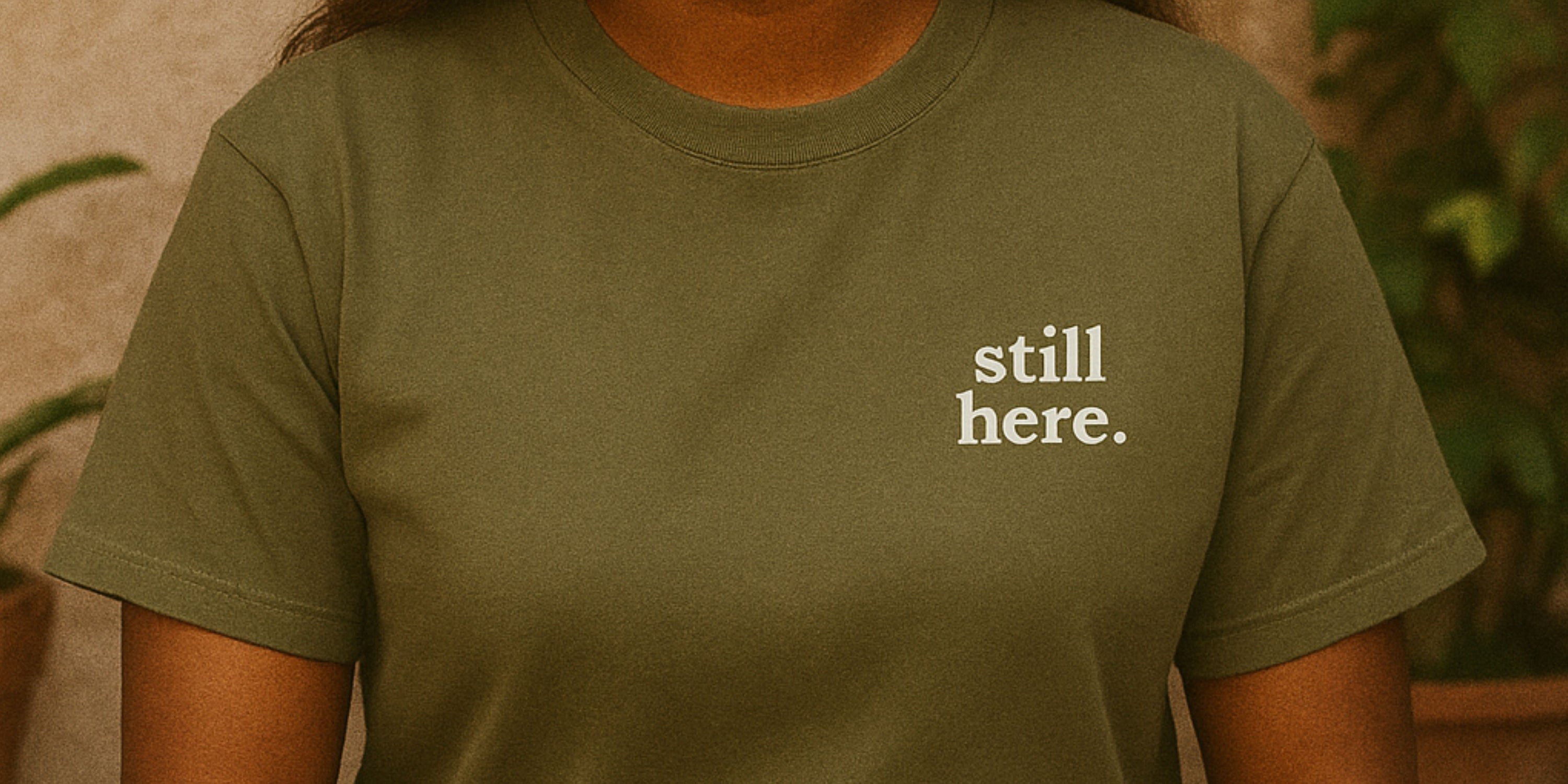 girl wearing still here shirt