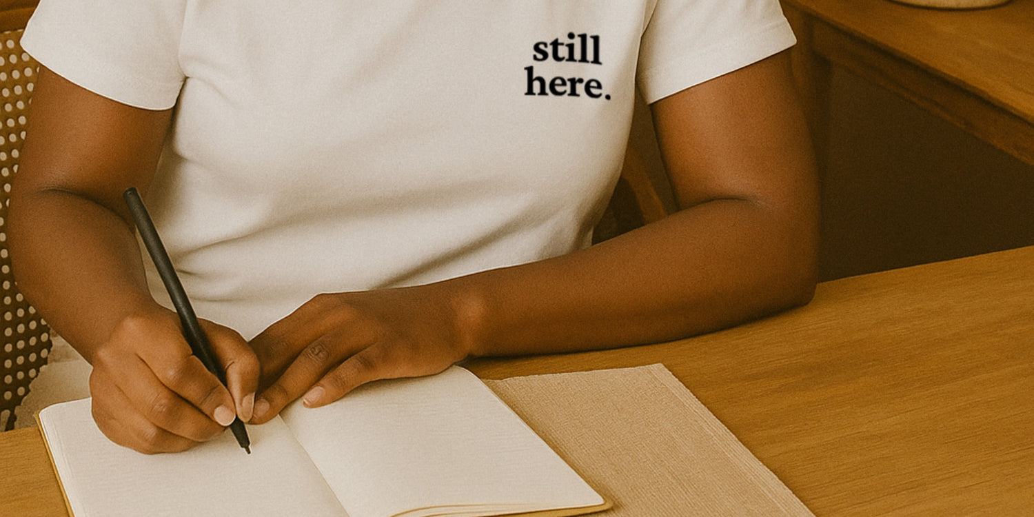 Sonesta Wilde wearing Still Here writing on journal